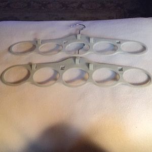 Two scarf and belt hangers.